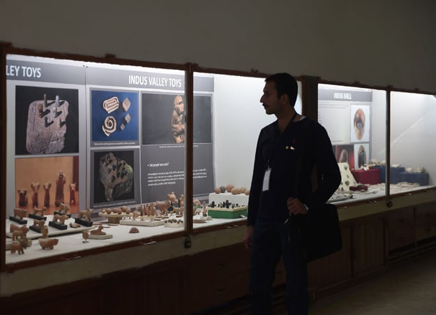 In this photograph taken on February 9, 2017, a Pakistani visitor walks through the museum at the UNESCO World Heritage archeological site of Mohenjo Daro, some 425 kms north of Karachi. PHOTO: AFP