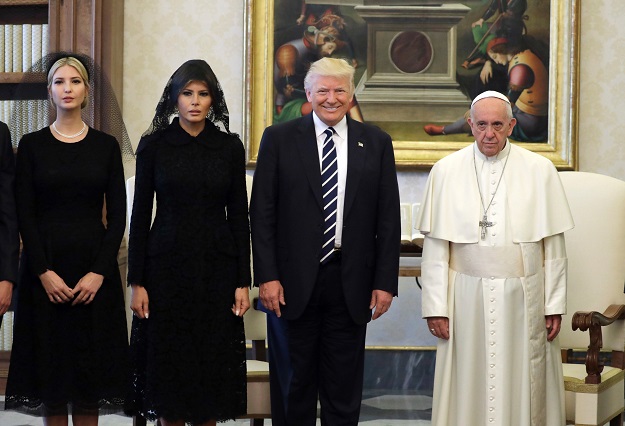 Pope Francis (R) poses with US President Donald Trump (C), US First Lady Melania Trump and the daughter of US President Donald Trump Ivanka Trump (L) at the end of a private audience at the Vatican on May 24, 2017. PHOTO: AFP