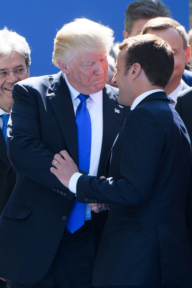 US President Donald Trump (L) shakes hands with French President Emmanuel Macron (R) as they  attend the unveiling ceremony of the new NATO headquarters in Brussels, on May 25, 2017, during a NATO (North Atlantic Treaty Organization) summit. PHOTO: AFP