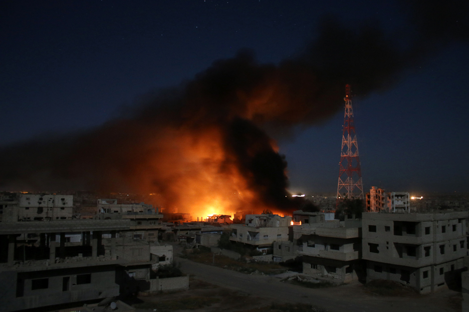 Smoke billows following a reported air strike on a rebel-held area in the southern Syrian city of Daraa. PHOTO: AFP