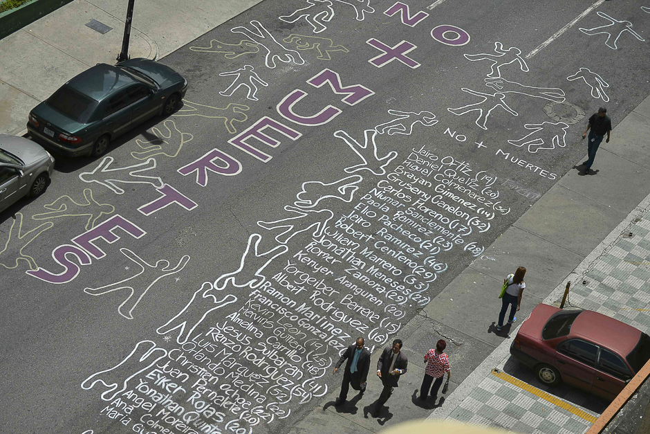 View of a street with the names of people killed during more than two months of protests against President Nicolas Maduro's government written by residents of a neighbourhood in eastern Caracas. PHOTO: AFP