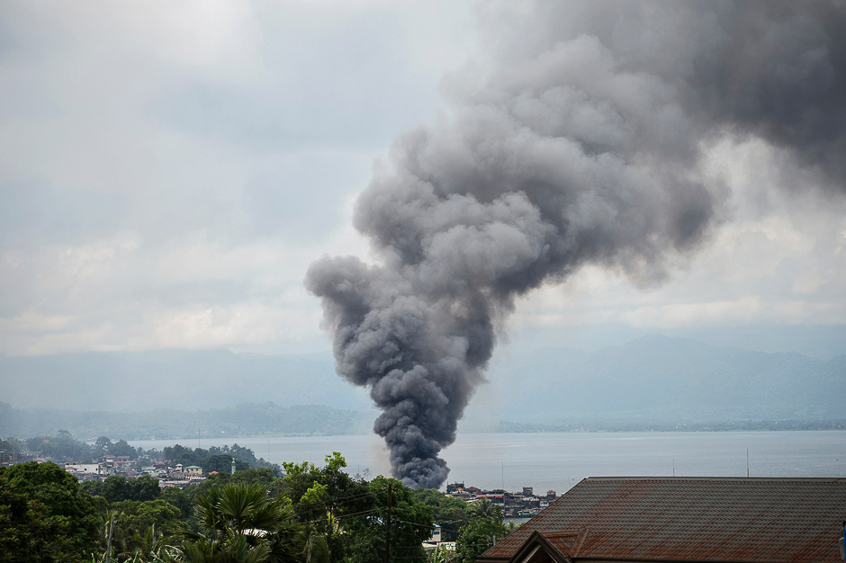 Smoke rises after aerial bombings by Philippine Air Force planes on Islamist militant positions in Marawi, on the southern island of Mindanao. PHOTO: AFP