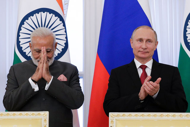 russian president vladimir putin r and indian prime minister narendra modi attend a signing ceremony following their meeting on the sidelines of the st petersburg international economic forum spief in saint petersburg on june 1 2017 photo afp