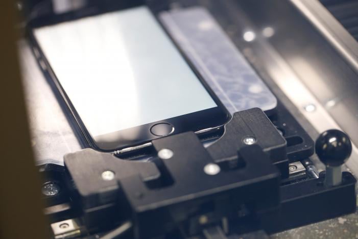 a repaired apple iphone is seen inside the proprietary horizon machine fixture as it undergoes a repair procedure at apple 039 s display repair laboratory in sunnyvale california us may 19 2017 photo reuters