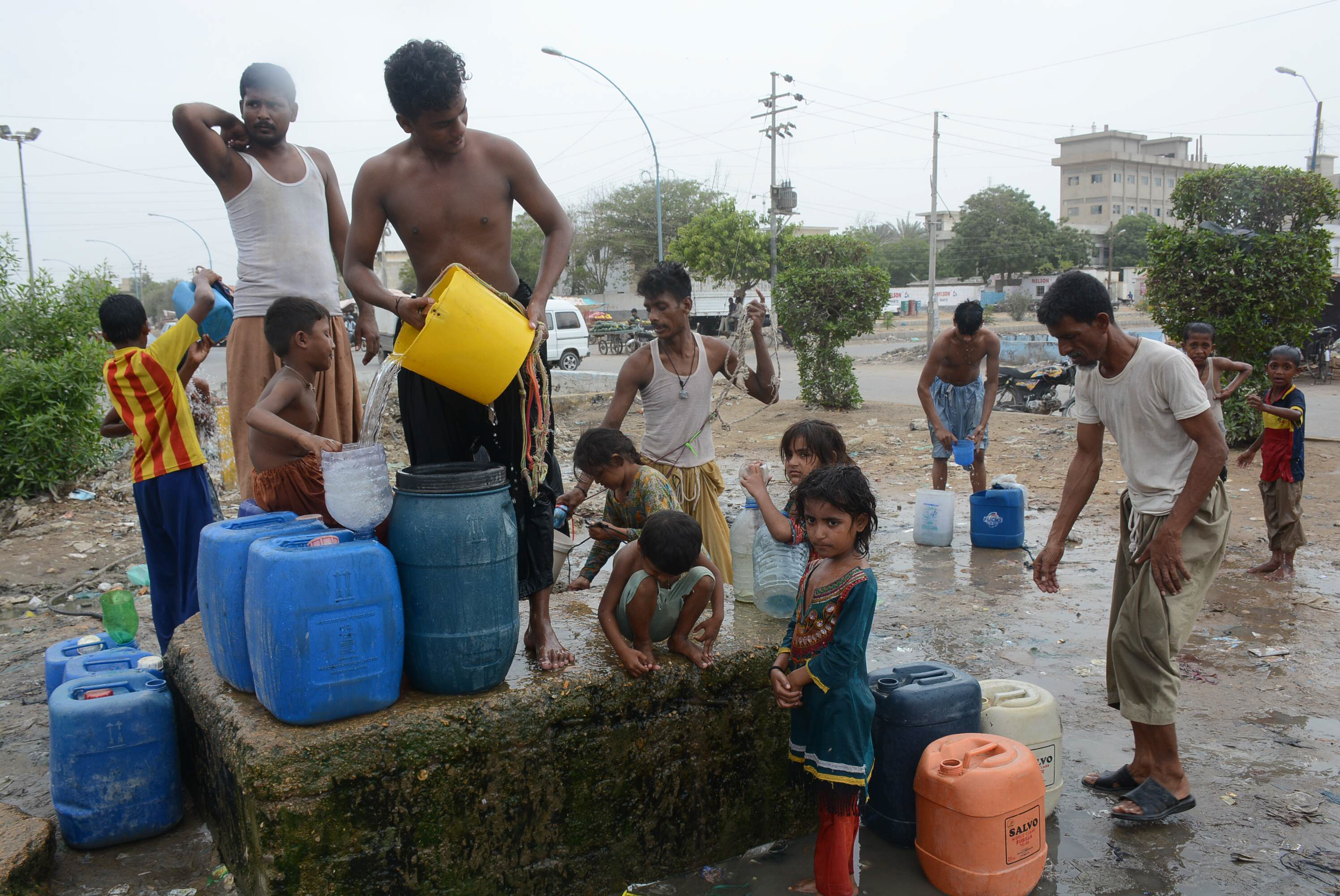 people filling their containers with water near korangi due to the shortage of water the judicial commission was formed to investigate lack of water supply and poor sanitation conditions in sindh photo file