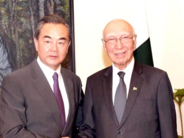 Chinese Foreign Minister Wang Yi with PM's Advisor of Foreign Affairs Sartaj Aziz