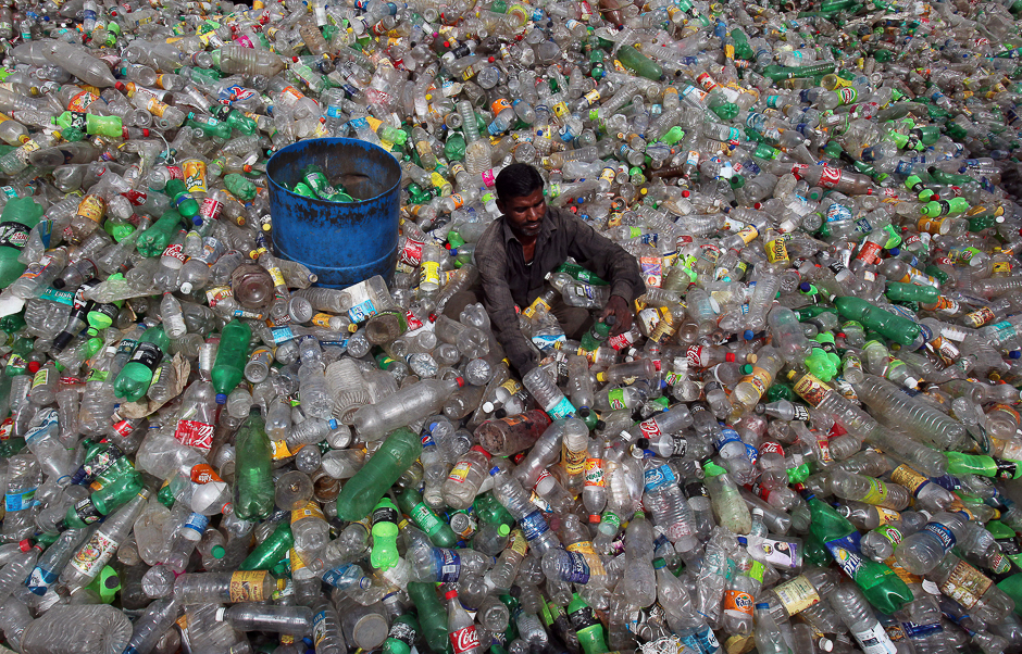 A man sorts bottles at a plastic junkyard on World Environment Day, in Chandigarh, India. PHOTO: REUTERS
