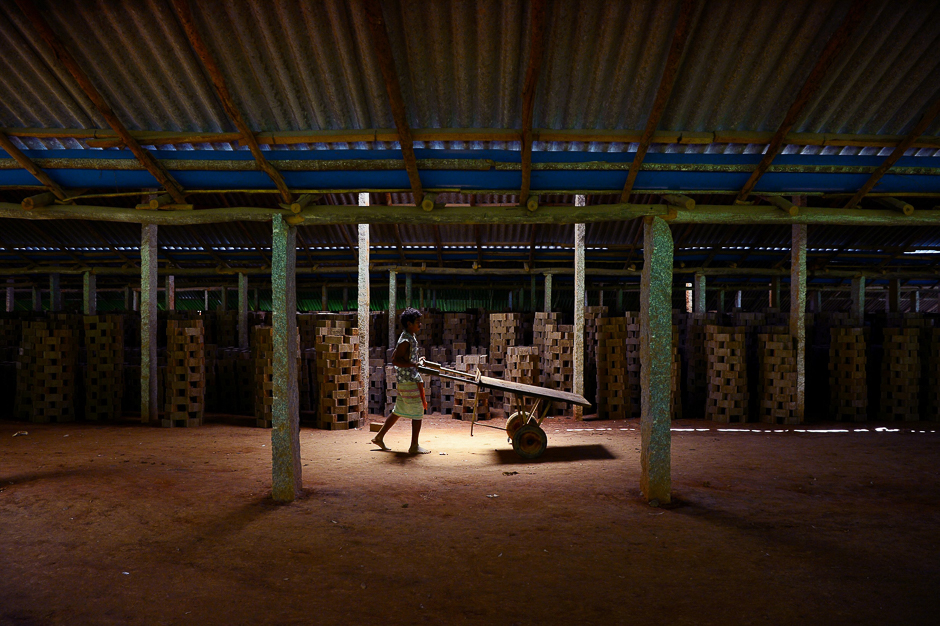 An Indian labourer works at a brick-manufacturing factory situated on the outskirts of Bangalore. PHOTO: AFP