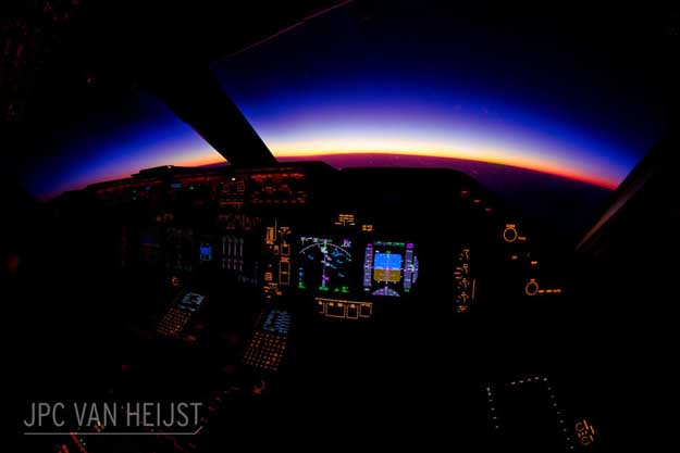 A beautiful purple sunrise over Myanmar (Burma) as seen from the first officer's seat of a 747-8.