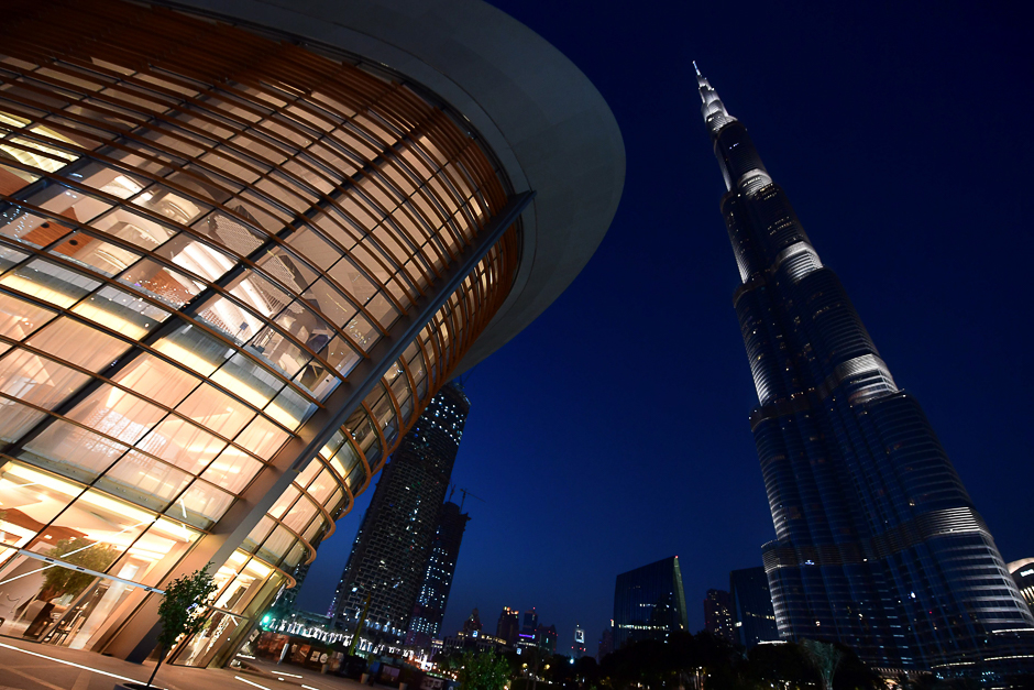 A picture shows a general view of the exterior of the Dubai Opera with the Burj Khalifa nearby, in downtown Dubai in the United Arab Emirates. PHOTO: AFP