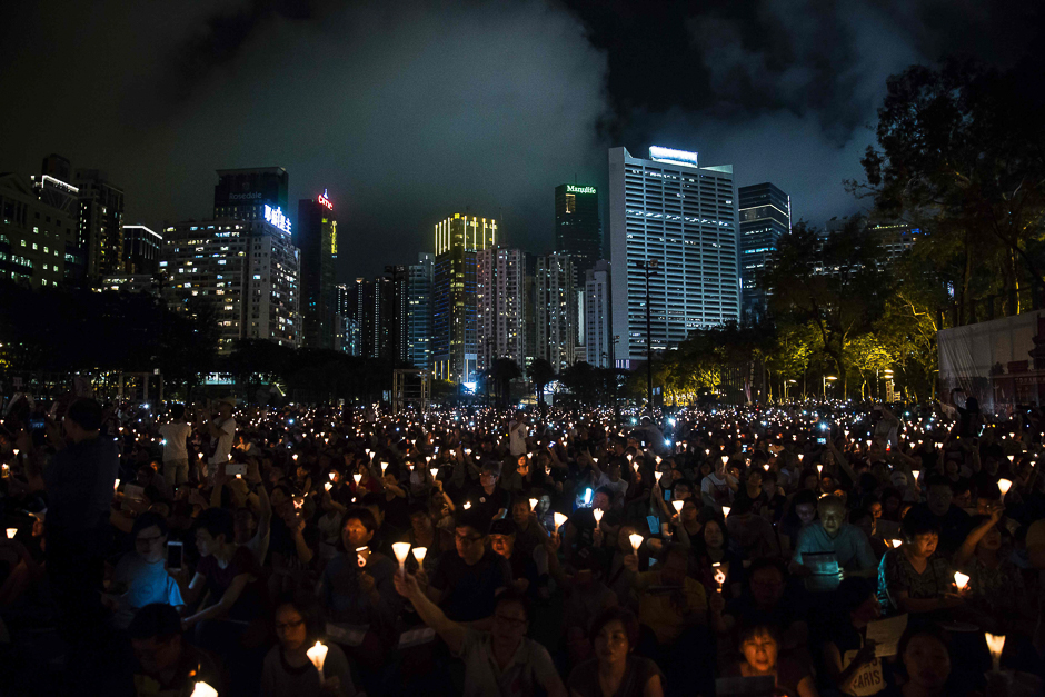 Members of the public hold candles at a vigil in Hong Kong to mark the 28th anniversary of the 1989 Tiananmen crackdown in Beijing. PHOTO: AFP