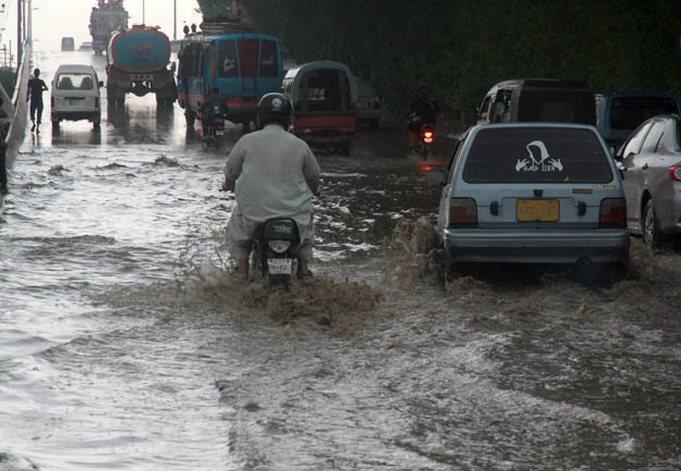 The city's streets were flooded on Thursday after two days of sporadic rain. PHOTO: ATHAR KHAN/EXPRESS