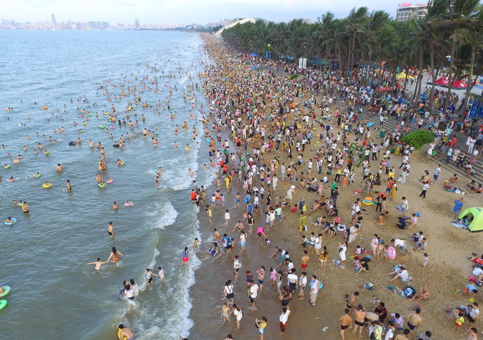 Crowds on a beach in Haikou on China's southern Hainan Island. Tens of thousands crowded beaches on the island on a national holiday to mark the Dragon Boat Festival. PHOTO: AFP