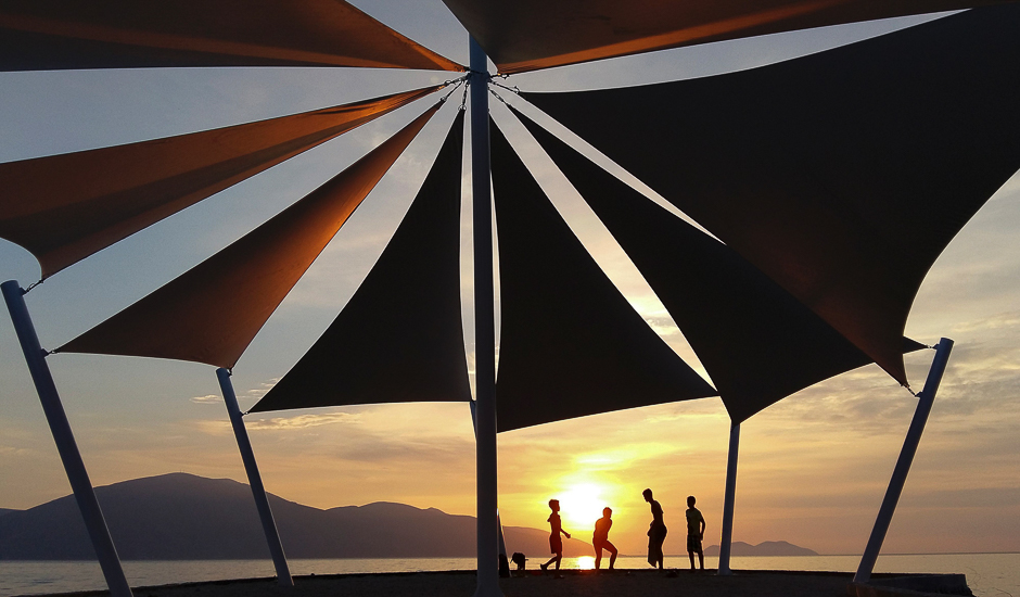 Children play at sunset in the shores of Adriatic sea near the city of Vlore. PHOTO: AFP
