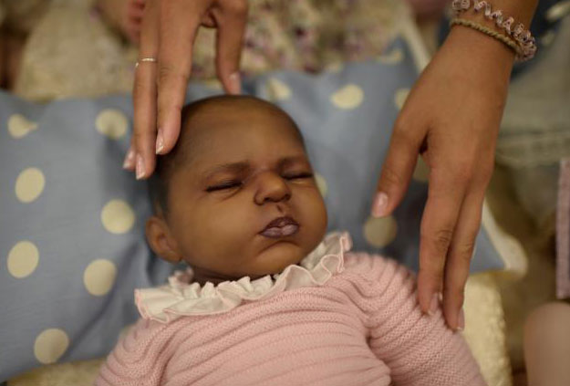 A baby made of vinyl is displayed at the Bilbao Reborn Doll Show, a trade fair featuring hyperrealist silicone and vinyl babies, known as 'Reborns', in Bilbao, northern Spain June 11, 2017. PHOTO: REUTERS