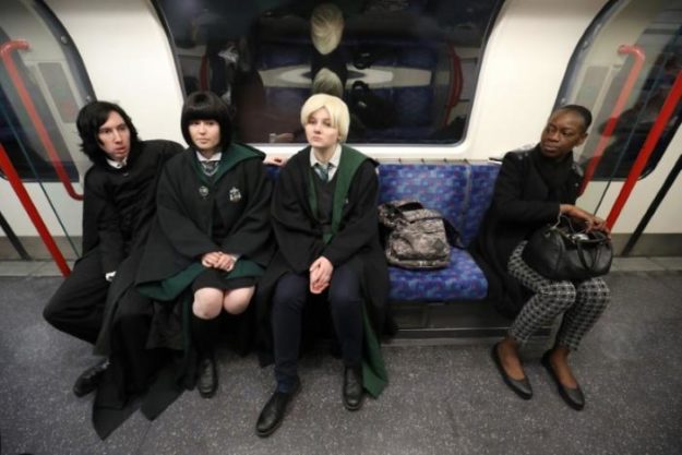 Cosplay fans (L-R) George Massingham, Abbey Forbes and Karolina Goralik travel by tube dressed in Harry Potter themed costumes, after a visit to one the literary franchise's movie filming locations at Leadenhall Market in London, Britain, March 10, 2017. REUTERS/Neil Hall