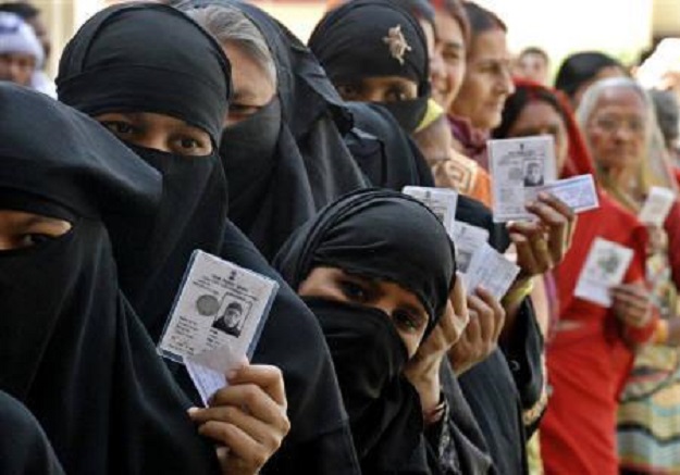 Muslim women in India stand in line to vote PHOTO: REUTERS