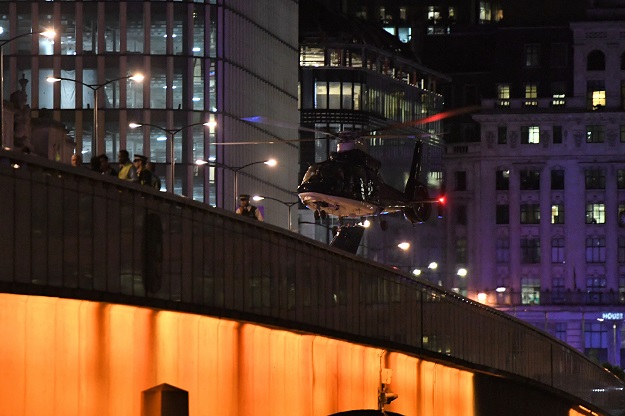 An emergency response helicopter lands on London Bridge, the scene of a terror attack in central London. PHOTO: AFP