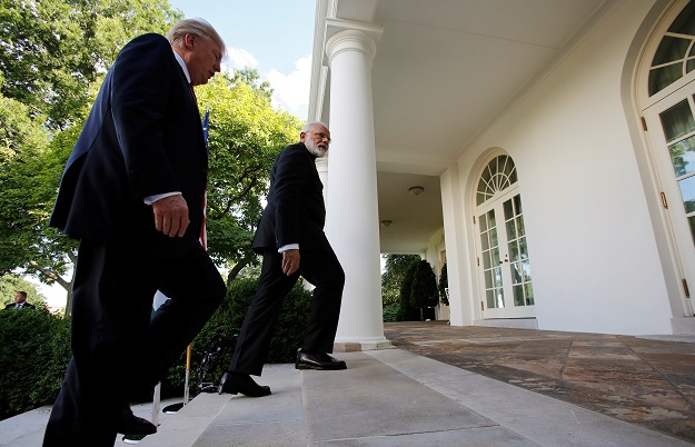  US President Donald Trump (L) and India's Prime Minister Narendra Modi head back to the Oval Office. PHOTO: REUTERS