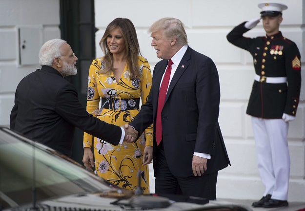 US President Donald Trump and First Lady Melania Trump bid farewell to Indian Prime Minister Narendra Modi on the South Lawn of the White House in Washington, DC. PHOTO: AFP