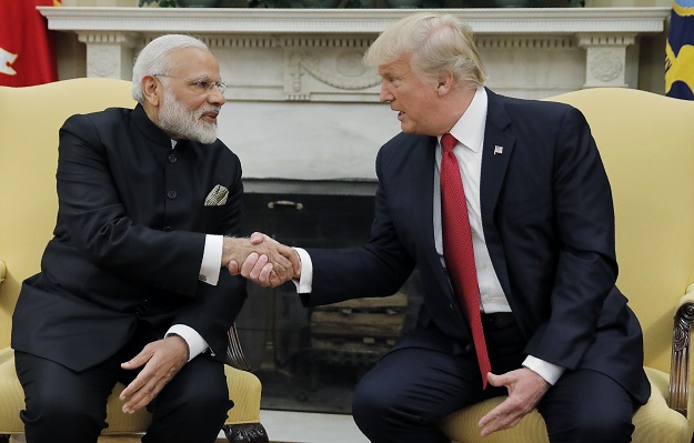 U.S. President Donald Trump shakes hands with India's Prime Minister Narendra Modi as they begin a meeting in the Oval Office of the White House in Washington, US. PHOTO: REUTERS