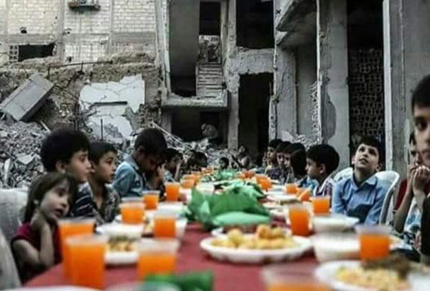 Residents of Douma can be seen breaking their fast as a symbol of resilience in the face of death and destruction. PHOTO: TWITTER