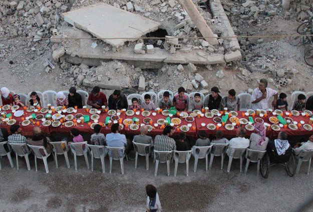 Residents of Douma can be seen breaking their fast as a symbol of resilience in the face of death and destruction. PHOTO: TWITTER