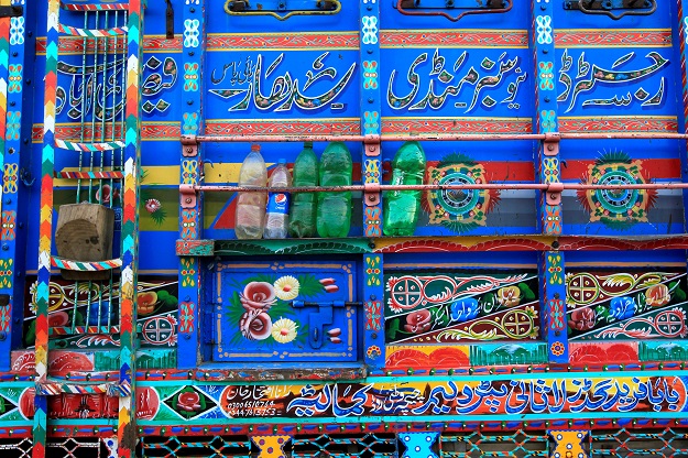  Plastic bottles used to store water and a tyre stopper are wedged on the side of a decorated truck in Faisalabad, Pakistan. PHOTO: REUTERS