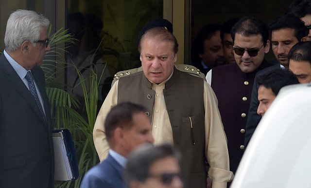 prime minister nawaz sharif alongside his son hussain nawaz appearing for jit photo reuters