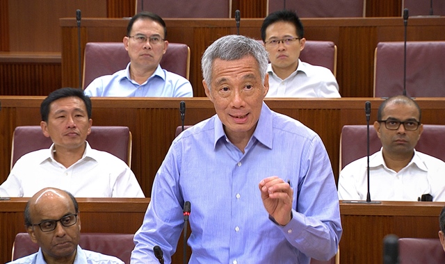 this handout photo released by the ministry of information and communication mci on july 3 2017 shows singapore prime minister lee hsien loong speaking at parliament house in singapore photo afp