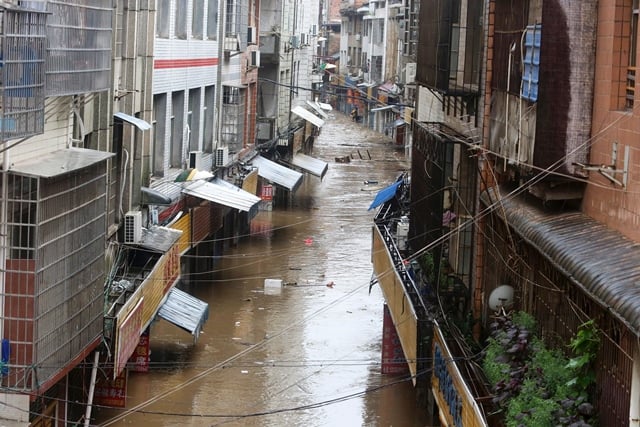 this picture taken on july 2 2017 shows a general view of a flooded street in loudi hunan province photo afp