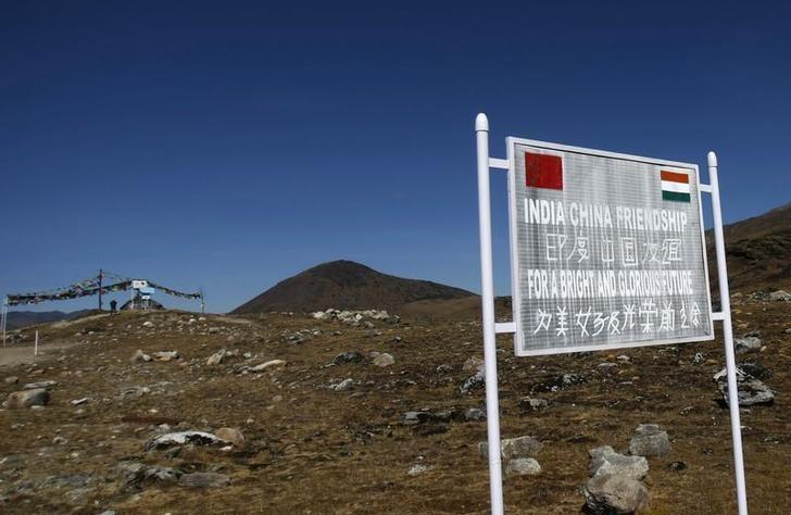 a signboard is seen from the indian side of the indo china border at bumla in arunachal pradesh photo reuters