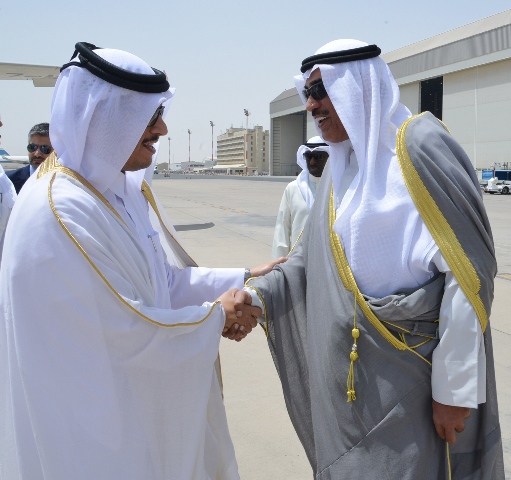 a handout picture released by the emiri diwan in kuwait on july 3 2017 shows kuwaiti foreign minister sheikh sabah al khaled al sabah r shaking hands with qatari foreign minister sheikh mohammad bin abdulrahman al thani at kuwait international airport in kuwait city photo afp