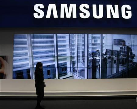 a visitor walks past the samsung booth at the gsma mobile world congress in barcelona february 16 2011 photo reuters