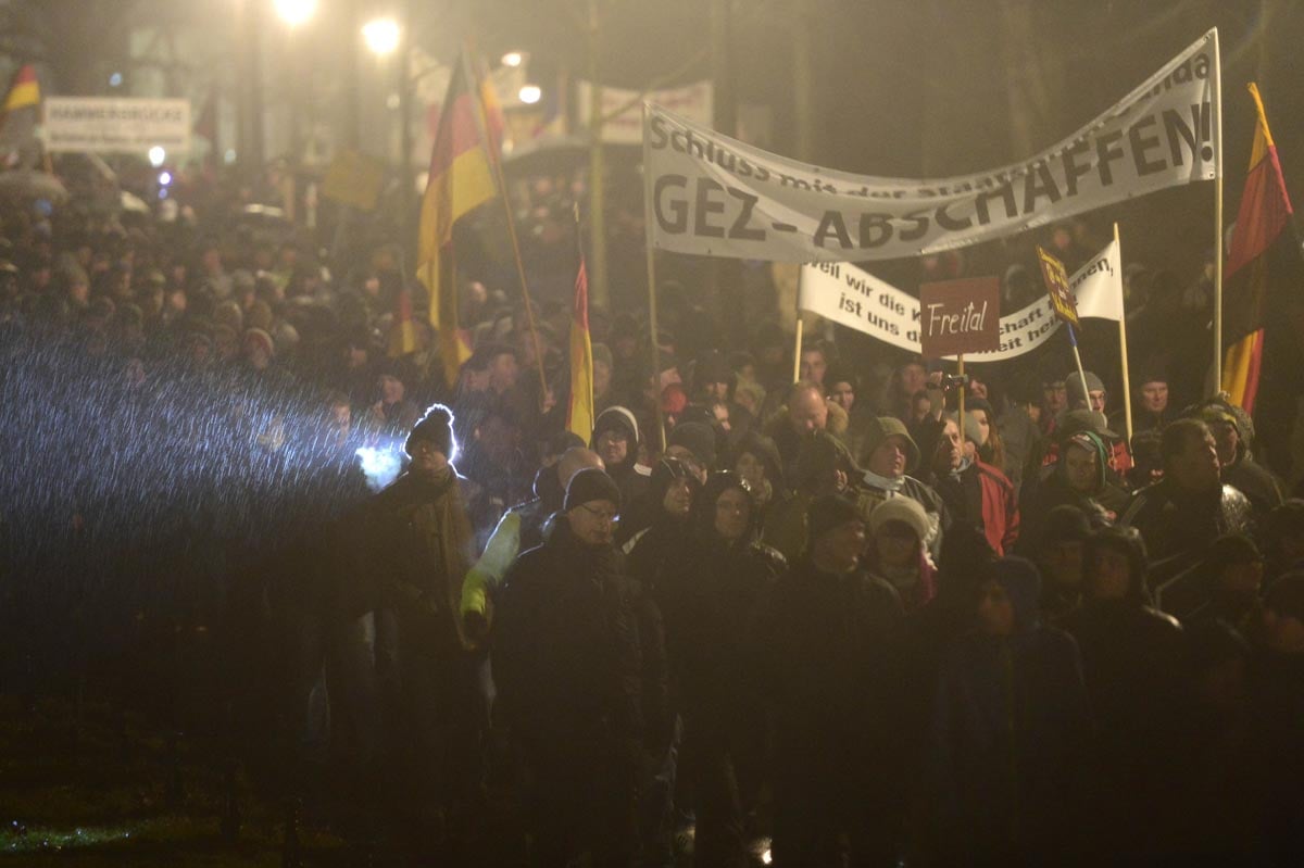 demonstrators take part in a rally by a mounting right wing populist movement on january 5 2015 in dresden eastern germany photo afp