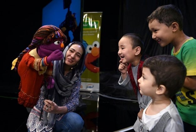 afghan children meet sesame street muppet 039 zari 039 after a recording at a television studio in kabul photo afp