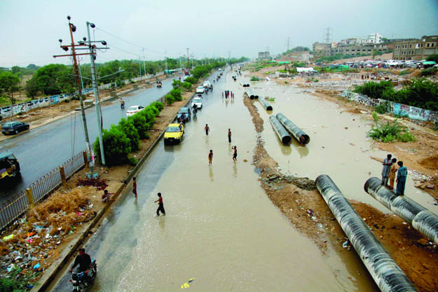 flooded road the university road was covered with water after rains due to inefficient drainage photo file