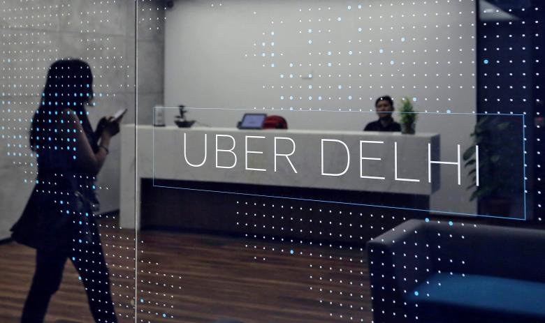 an employee walks inside the office of ride hailing service uber in gurugram previously known as gurgaon on the outskirts of new delhi india april 19 2016 photo reuters