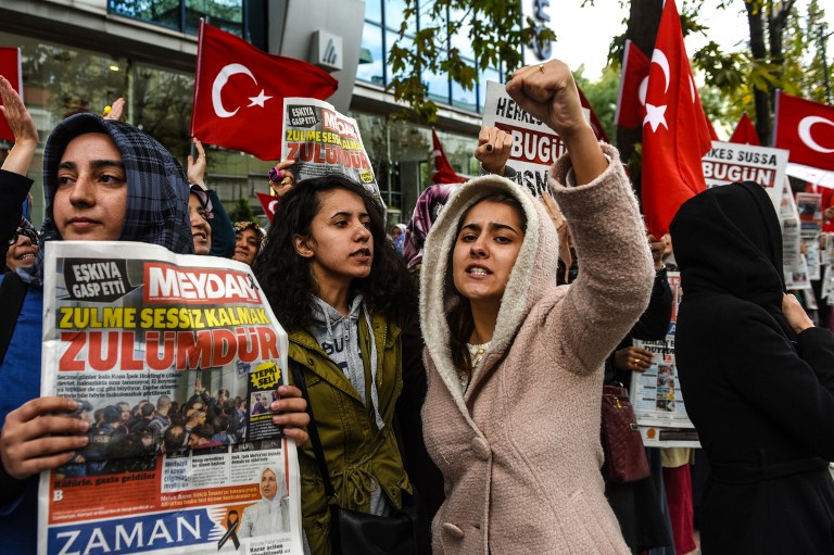 turkish protesters shout slogans outside the headquarters of bugun newspaper and kanalturk television station in istanbul photo afp