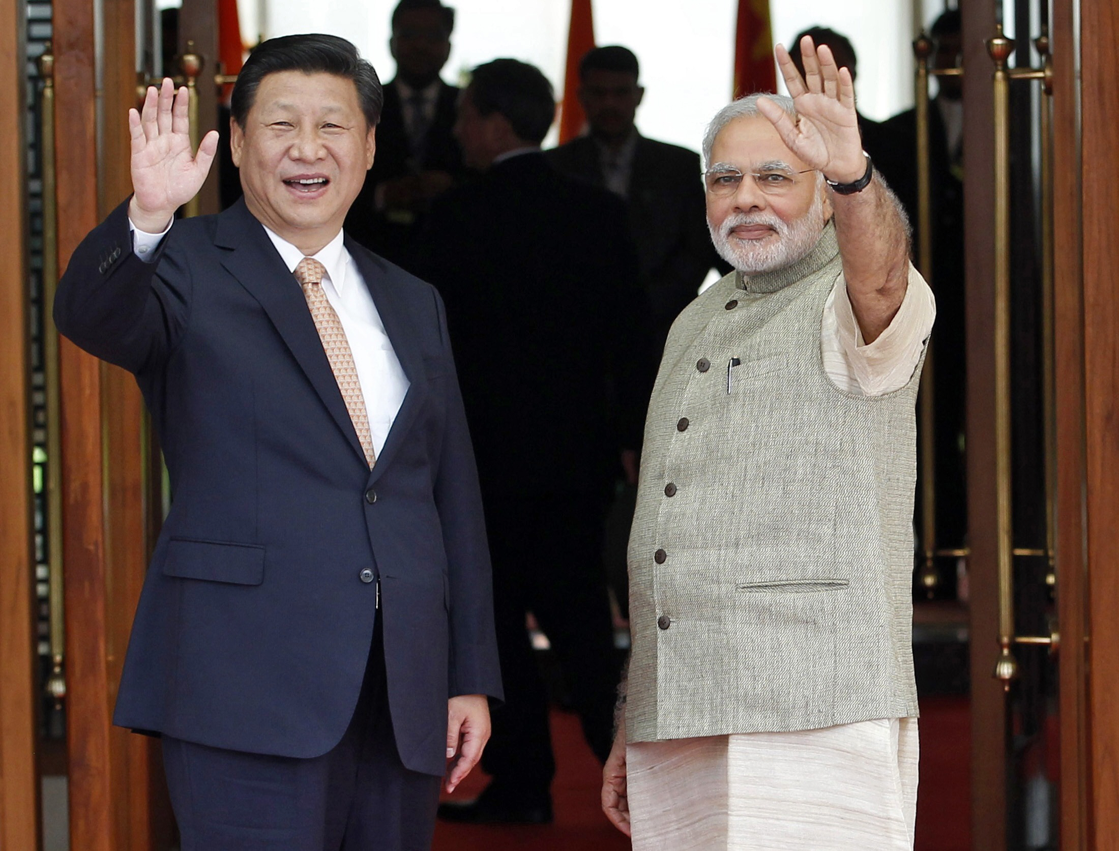 india 039 s prime minister narendra modi r and china 039 s president xi jinping wave before their meeting in ahmedabad september 17 2014 photo reuters file