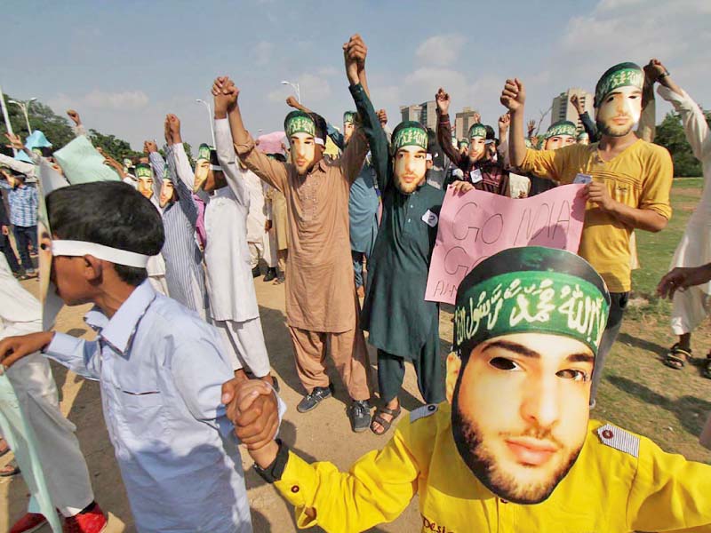 children don masks depicting slain hizbul mujahideen leader burhan wani at a protest in islamabad photo online