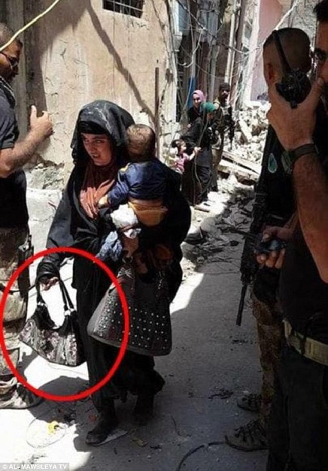 female suicide bomber holding her baby is pictured moments before she blew the two of them up in mosul seconds from detonation female suicide bomber holding her baby is pictured moments before she blew the two of them up in mosul in a bid to slaughter soldiers a photo emerged of a mosul woman with her baby before detonating a bomb photo al mawsleya tv