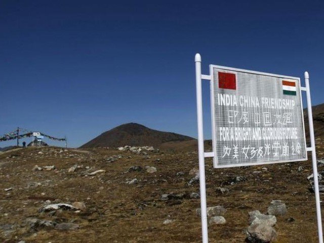 a signboard is seen from the indian side of the indo china border at bumla in arunachal pradesh photo reuters