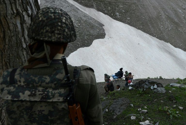 hundreds of thousands of hindu pilgrims trek over mountain trails to reach amarnath caves around 3 900 metres above sea level in indian kashmir every year photo afp