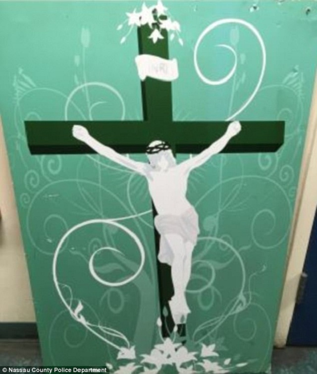 the green and white painting of jesus hanging on the cross was left outside hillsdale mosque photo nassau police county