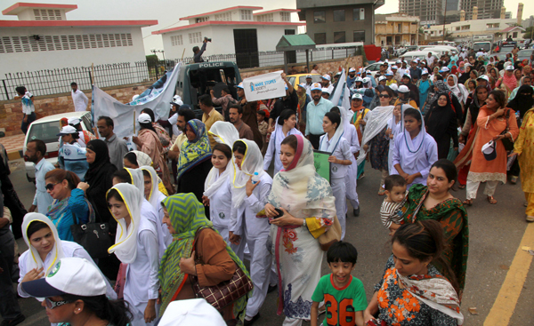 the walk on the world population day was organised by the population welfare department and was attended by a large number of people from all walks of life photo athar khan