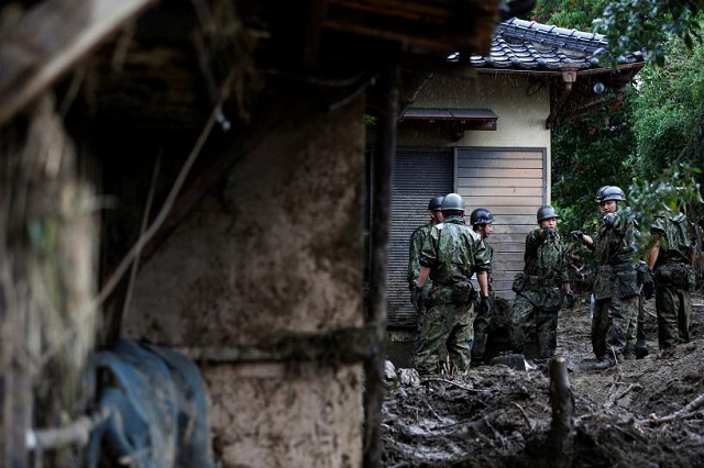 japanese self defense force soldiers conduct search and rescue operation at a damaged house caused by a heavy rain in asakura fukuoka prefecture japan july 9 2017 photo reuters