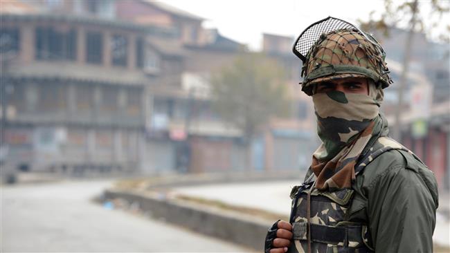 an indian paramilitary trooper stands guard during a clampdown in iok photo afp