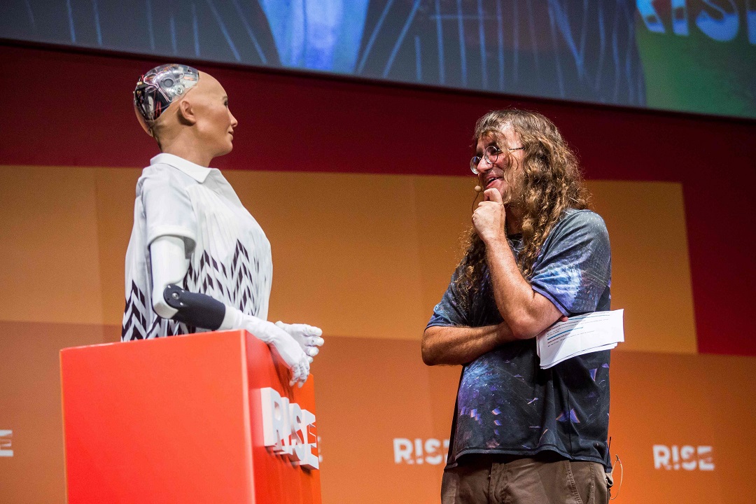 chief scientist of hanson robotics ben goertzel r interacts with quot sophia the robot quot l during a discussion about the future of humanity in a demonstration of artificial intelligence ai by hanson robotics photo afp