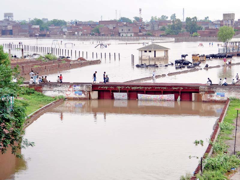 an underpass submerged in rainwater in gujranwala photo express